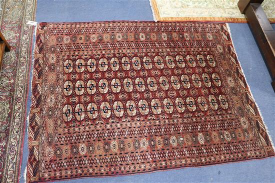 A Bokhara rug and two other rugs, in poor condition (3)